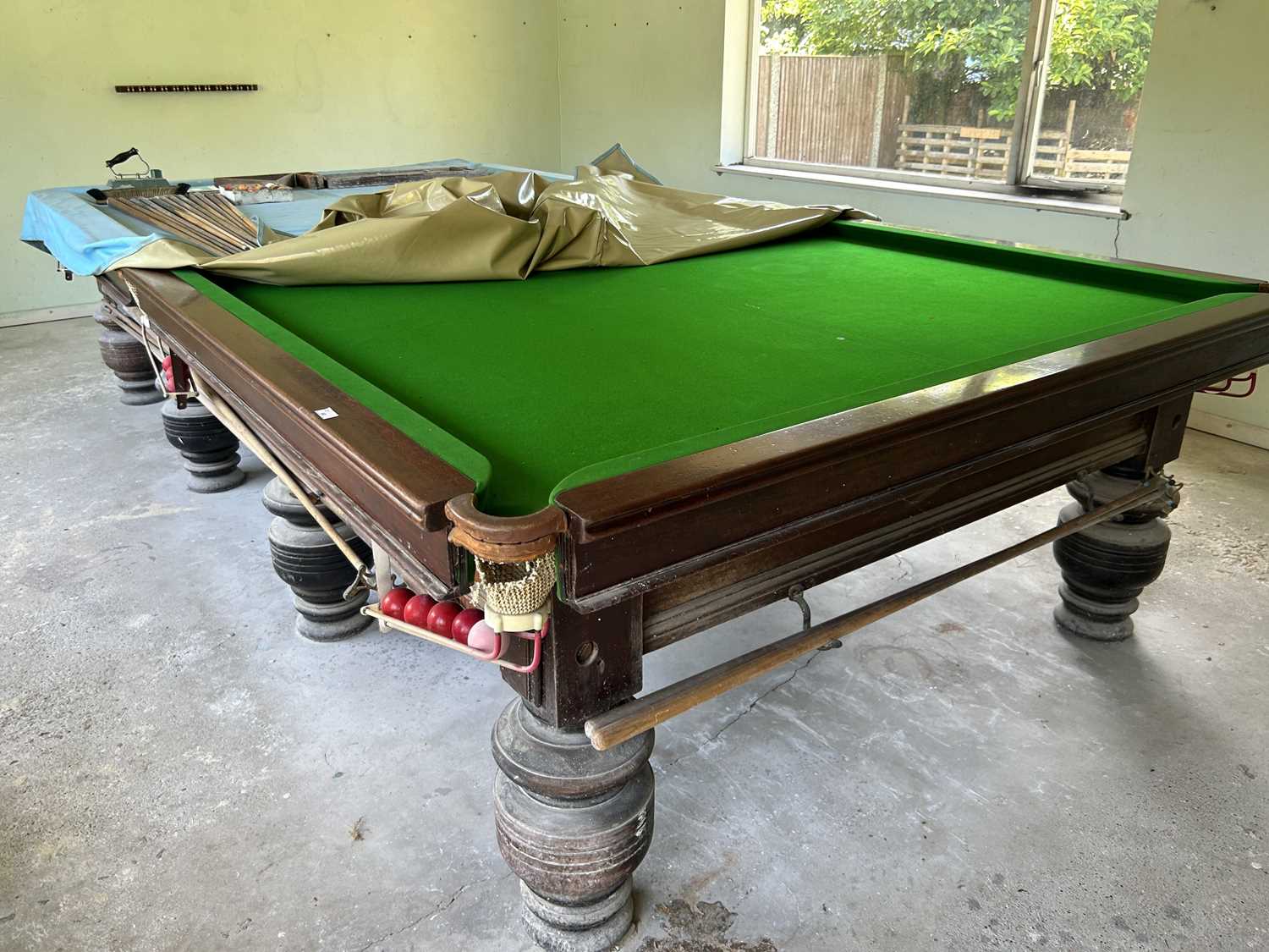 Lot 60 - A full size snooker table together with cues,...