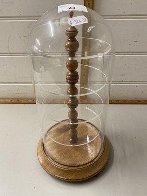 Lot 23 - A glass dome with hardwood base