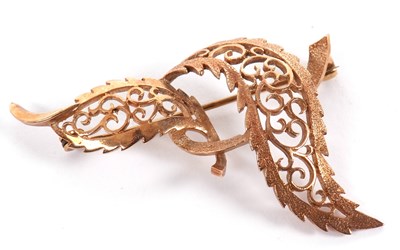 Lot 111 - A 9ct leaf brooch, the two curving leaves with...