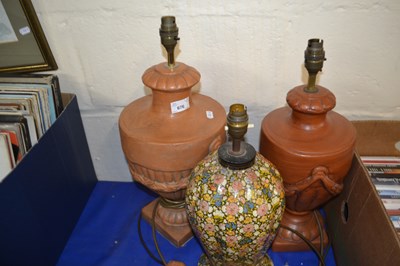 Lot 676 - Two pottery urn style table lamps together...