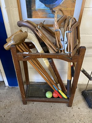 Lot 220 - Stick stand containing vintage rackets, hockey...