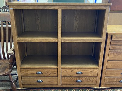 Lot 238 - Modern light oak shelf with base drawers,...