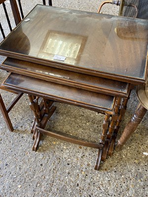 Lot 273 - A nest of three glass top tables