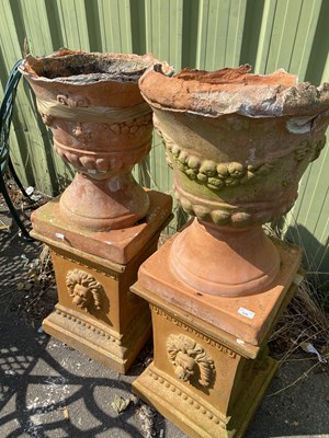 Lot 335 - Pair of terracotta pedestals with lion mask...