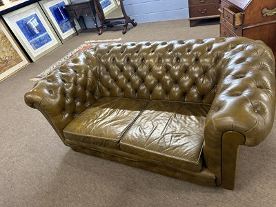 Lot 640 - Mid brown leather Chesterfield two seater sofa,...