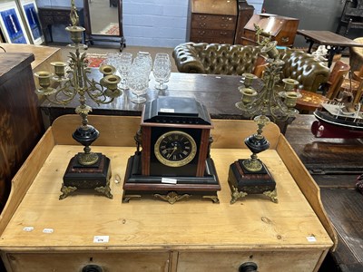 Lot 392 - A French black slate and red marble clock...