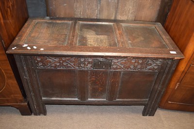 Lot 599 - An 18th Century oak coffer with hinged panel...