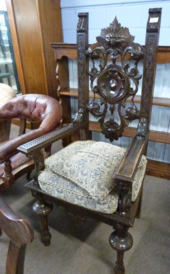 Lot 607 - A Victorian dark gothic oak throne type chair...