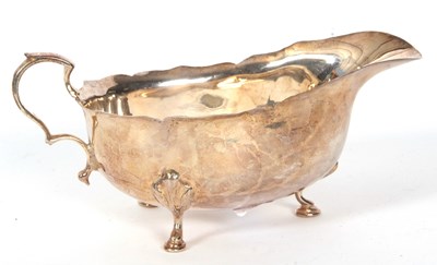 Lot 10 - A hallmarked silver sauce boat of typical form...