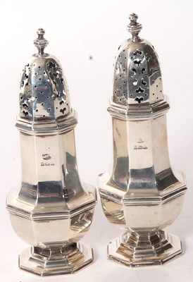 Lot 59 - Pair of George V silver casters of octagonal...