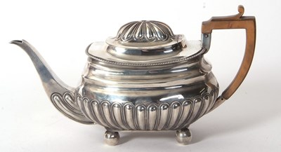 Lot 70 - A George III teapot with a part lobed body...