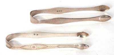 Lot 95 - A pair of Georgian silver sugar tongs, bright...