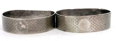 Lot 142 - Two hallmarked silver D shaped serviette rings,...