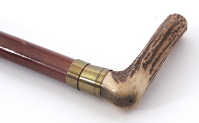 Lot 194 - A horn handled walking stick, the pull off...