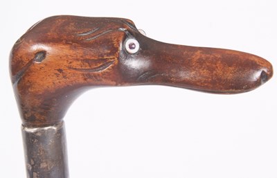 Lot 199 - A walking stick carved with a dogs head handle,...