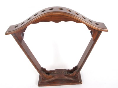 Lot 206 - A stained wooden fan shaped stick stand for...