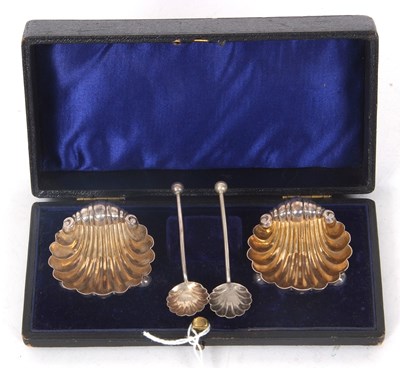 Lot 252 - A chased pair of Victorian shell shaped salts...