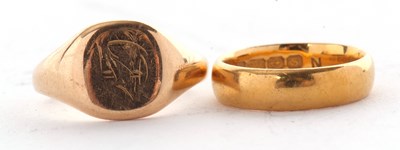 Lot 137 - Two gold rings, to include a 22ct wedding band,...