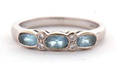 Lot 49 - An 18ct aquamarine and diamond ring, the three...