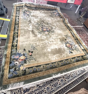 Lot 683 - A large Chinese silk mix floral rug 10' x 8' ....