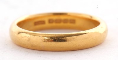 Lot 147 - A 22ct wedding band, Birmingham 1937, size N,...