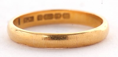 Lot 150 - A 22ct wedding band, Birmingham 1957, size L,...