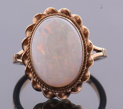 Lot 2 - A 9ct opal ring, the oval opal cabochon,...