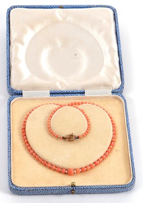 Lot 94 - A coral and seed pearl choker, the graduated...