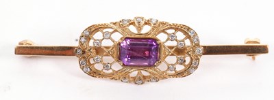 Lot 126 - A 9ct amethyst and diamond bar brooch, set to...