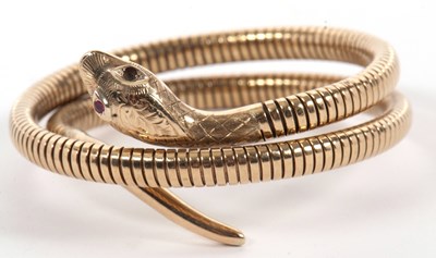 Lot 109 - A 9ct coiled snake bracelet, with naturalistic...