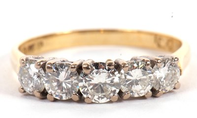 Lot 10 - An 18ct five stone diamond ring, the five...