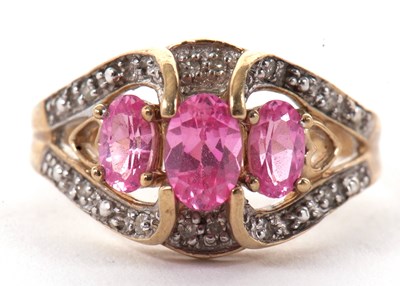 Lot 34 - A 9ct pink gemstone and diamond ring, the...