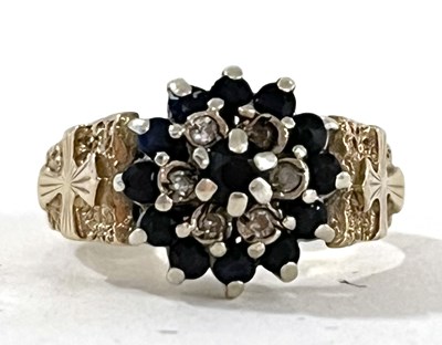 Lot 19 - A 9ct sapphire and diamond cluster ring, with...