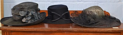 Lot 116 - Three hats to include a navy blue wool felt...