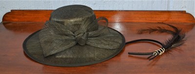 Lot 117 - A black straw hat by First Avenue and a...