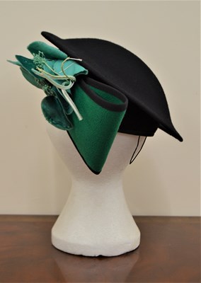 Lot 107 - A vintage black and green wool felt hat by...