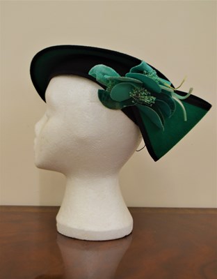 Lot 107 - A vintage black and green wool felt hat by...