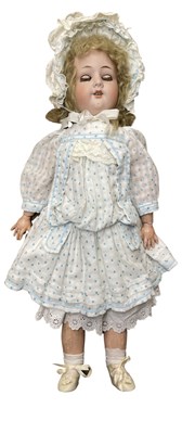 Lot 339 - A Hermann Steiner bisque head doll with blue...