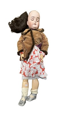 Lot 337 - A Karl Hartmann bisque head doll in brown...