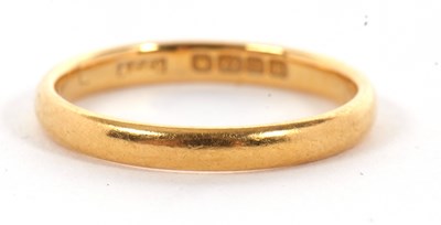 Lot 135 - A 22ct wedding band, Birmingham 1932, size L,...