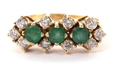 Lot 33 - A 14ct emerald and white stone ring, the three...