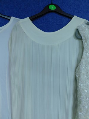 Lot 53 - Three cream lady's occasion wear dresses to...
