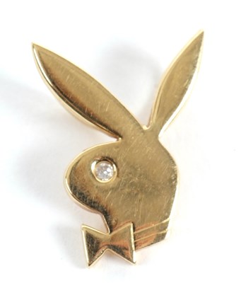 Lot 107 - An 18ct playboy bunny pendant with small...